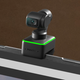 The Insta360 Link webcam perched atop a computer screen.